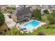 Aerial view of a home with a private pool, a large patio area, and lush landscaping at 208 Eagles Flight, Villa Rica, GA 30180
