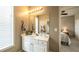 Bathroom with sink, mirror, and natural light from a window at 208 Eagles Flight, Villa Rica, GA 30180