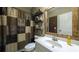 Rustic-chic bathroom with wood accents, decorative shelves, and a stylish shower curtain at 208 Eagles Flight, Villa Rica, GA 30180