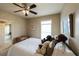 Cozy bedroom featuring a ceiling fan, and plush pillows atop the bed at 208 Eagles Flight, Villa Rica, GA 30180