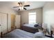 Bright bedroom with two twin beds, ceiling fan, and closet access at 208 Eagles Flight, Villa Rica, GA 30180