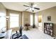 Comfortable home office with natural light from two windows, desk and office chair and stylish furniture at 208 Eagles Flight, Villa Rica, GA 30180
