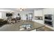 Open kitchen with granite countertops and stainless steel appliances overlooks the living area at 208 Eagles Flight, Villa Rica, GA 30180