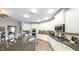 Modern kitchen with white cabinetry, granite countertops, and stainless steel appliances at 208 Eagles Flight, Villa Rica, GA 30180