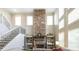 This beautiful living room features a stone fireplace, staircase and lots of natural light at 208 Eagles Flight, Villa Rica, GA 30180