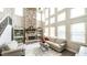 Inviting living room with stone fireplace, large windows, and comfortable seating area at 208 Eagles Flight, Villa Rica, GA 30180