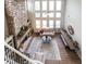 Birds-eye view of a living room with stone fireplace, bench seating, and natural light at 208 Eagles Flight, Villa Rica, GA 30180