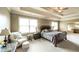 This main bedroom features neutral decor, tray ceilings and an ensuite bath with garden tub at 208 Eagles Flight, Villa Rica, GA 30180
