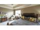 A seating area adds charm to the spacious main bedroom with great natural light at 208 Eagles Flight, Villa Rica, GA 30180