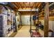 Finished basement with exposed ceiling and wood walls used for storage and exercise at 2997 Happy Hollow Se Dr, Conyers, GA 30094