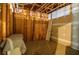 Unfinished basement space with exposed framework, offering potential for customization and storage at 2997 Happy Hollow Se Dr, Conyers, GA 30094