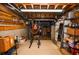 Basement with exposed ceiling, shelving, and workout equipment at 2997 Happy Hollow Se Dr, Conyers, GA 30094