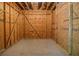Unfinished basement space with exposed studs, offering potential for customization and extra storage at 2997 Happy Hollow Se Dr, Conyers, GA 30094
