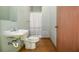 Cozy full bathroom with patterned linoleum flooring and a shower and bathtub combination at 2997 Happy Hollow Se Dr, Conyers, GA 30094