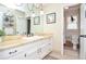 Bright bathroom featuring a vanity, mirror, and toilet in the ensuite at 2997 Happy Hollow Se Dr, Conyers, GA 30094