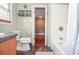 Bathroom featuring a toilet, vanity, and bathtub with shower at 2997 Happy Hollow Se Dr, Conyers, GA 30094