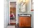 Bathroom featuring a wood vanity and ensuite access to the bedroom at 2997 Happy Hollow Se Dr, Conyers, GA 30094