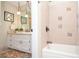 Ensuite bathroom with tile, bathtub and shower combo, and vanity at 2997 Happy Hollow Se Dr, Conyers, GA 30094