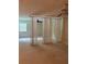 Spacious bedroom area with neutral carpet, ceiling fan, and natural light at 2997 Happy Hollow Se Dr, Conyers, GA 30094
