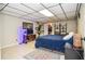 Bedroom with a bed, a small media center, and a decorative plant at 2997 Happy Hollow Se Dr, Conyers, GA 30094