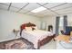 Bedroom featuring an ornate wooden bed frame, a small work desk and a soft area rug at 2997 Happy Hollow Se Dr, Conyers, GA 30094