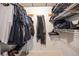Walk-in closet with white wire shelving units filled with clothes and shoes at 2997 Happy Hollow Se Dr, Conyers, GA 30094