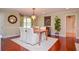 Dining room featuring hardwood floors, light fixtures, and classic decor at 2997 Happy Hollow Se Dr, Conyers, GA 30094