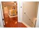Warm, hardwood entryway leads to bright living room with yellow accents at 2997 Happy Hollow Se Dr, Conyers, GA 30094