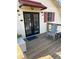 Charming cottage with outdoor deck and chair, a perfect spot to relax and enjoy the surroundings at 2997 Happy Hollow Se Dr, Conyers, GA 30094