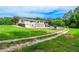 Beautiful home exterior with a spacious yard and fenced pool area in the backyard at 2997 Happy Hollow Se Dr, Conyers, GA 30094