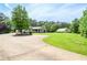 Spacious property with a ranch-style home, barn, and long driveway at 2997 Happy Hollow Se Dr, Conyers, GA 30094