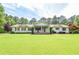 Charming ranch-style home with a manicured front yard and inviting covered porch at 2997 Happy Hollow Se Dr, Conyers, GA 30094