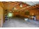 Large garage with high ceilings, ample storage, and multiple ceiling fans at 2997 Happy Hollow Se Dr, Conyers, GA 30094