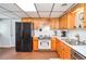 Efficient kitchen with wood cabinetry and white countertops for meal prep at 2997 Happy Hollow Se Dr, Conyers, GA 30094