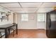 Practical kitchen with dining table, black fridge and access to backyard at 2997 Happy Hollow Se Dr, Conyers, GA 30094