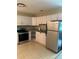 Kitchen featuring stainless steel appliances, white cabinets and neutral countertops at 2997 Happy Hollow Se Dr, Conyers, GA 30094