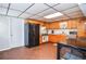 Functional kitchen with wood cabinets and black appliances; dining area at 2997 Happy Hollow Se Dr, Conyers, GA 30094