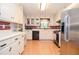Functional kitchen features white cabinets, stainless steel appliances, and ample counter space at 2997 Happy Hollow Se Dr, Conyers, GA 30094