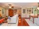 Open-concept living room with hardwood floors, comfortable seating, and inviting decor at 2997 Happy Hollow Se Dr, Conyers, GA 30094