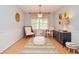 Bright living room featuring stylish decor, wood floors, and a cozy seating area at 2997 Happy Hollow Se Dr, Conyers, GA 30094
