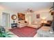 Cozy living room with ceiling fan, fireplace, and comfortable seating at 2997 Happy Hollow Se Dr, Conyers, GA 30094