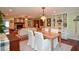 Open-concept living space combining dining and living areas with hardwood floors and natural light at 2997 Happy Hollow Se Dr, Conyers, GA 30094