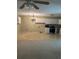 Combination living room and kitchen area with carpet and chandelier at 2997 Happy Hollow Se Dr, Conyers, GA 30094