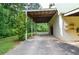 Wide covered patio with outdoor space, providing shelter and a relaxing area near lush greenery at 2997 Happy Hollow Se Dr, Conyers, GA 30094