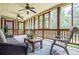 Relaxing sunroom features ceiling fans, wood accents and view of backyard at 2997 Happy Hollow Se Dr, Conyers, GA 30094