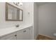 Bathroom with white vanity, framed mirror, and updated fixtures at 403 Abingdon Way, Atlanta, GA 30328
