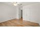 Spacious bedroom features hardwood floors, a ceiling fan, and a closet for storage at 403 Abingdon Way, Atlanta, GA 30328