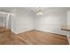 Well-lit dining room boasts wood floors and crown molding with neutral paint, perfect for gatherings at 403 Abingdon Way, Atlanta, GA 30328