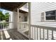 Condo exterior featuring a wooden balcony with white railing and white siding with shutters at 403 Abingdon Way, Atlanta, GA 30328