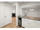 Updated kitchen pass through boasts stainless steel appliances, granite countertops and a view to the fireplace at 403 Abingdon Way, Atlanta, GA 30328